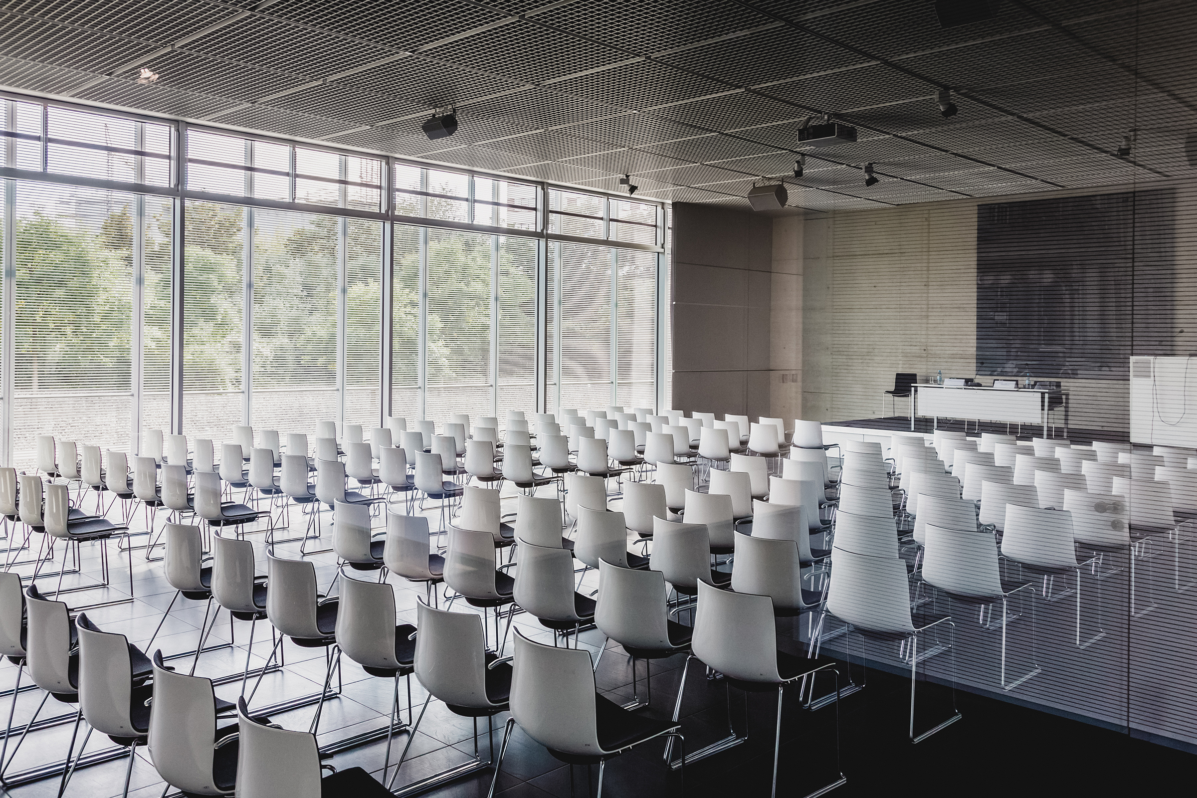 empty white chairs contemporary conference hall