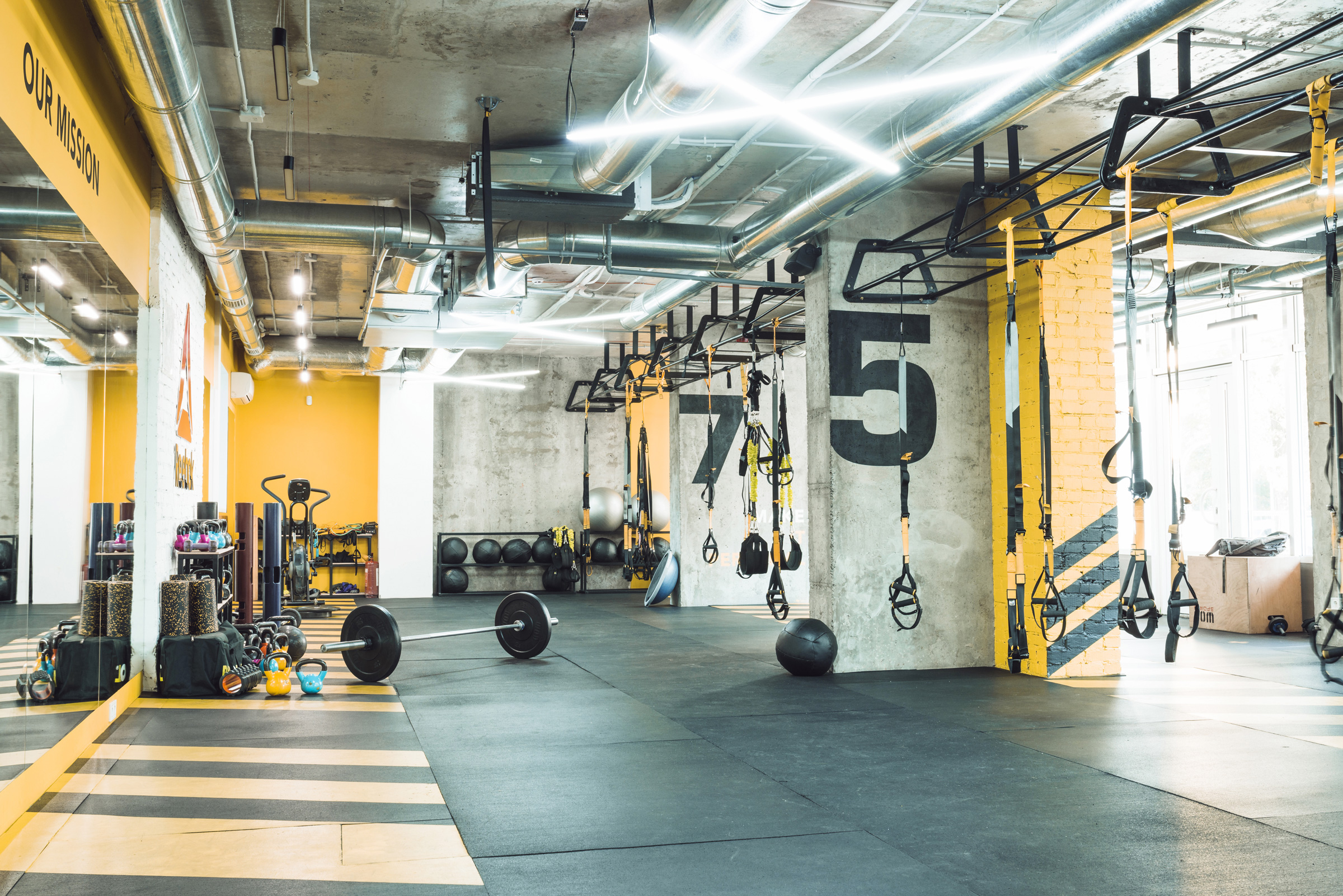 modern gym interior with exercise equipments